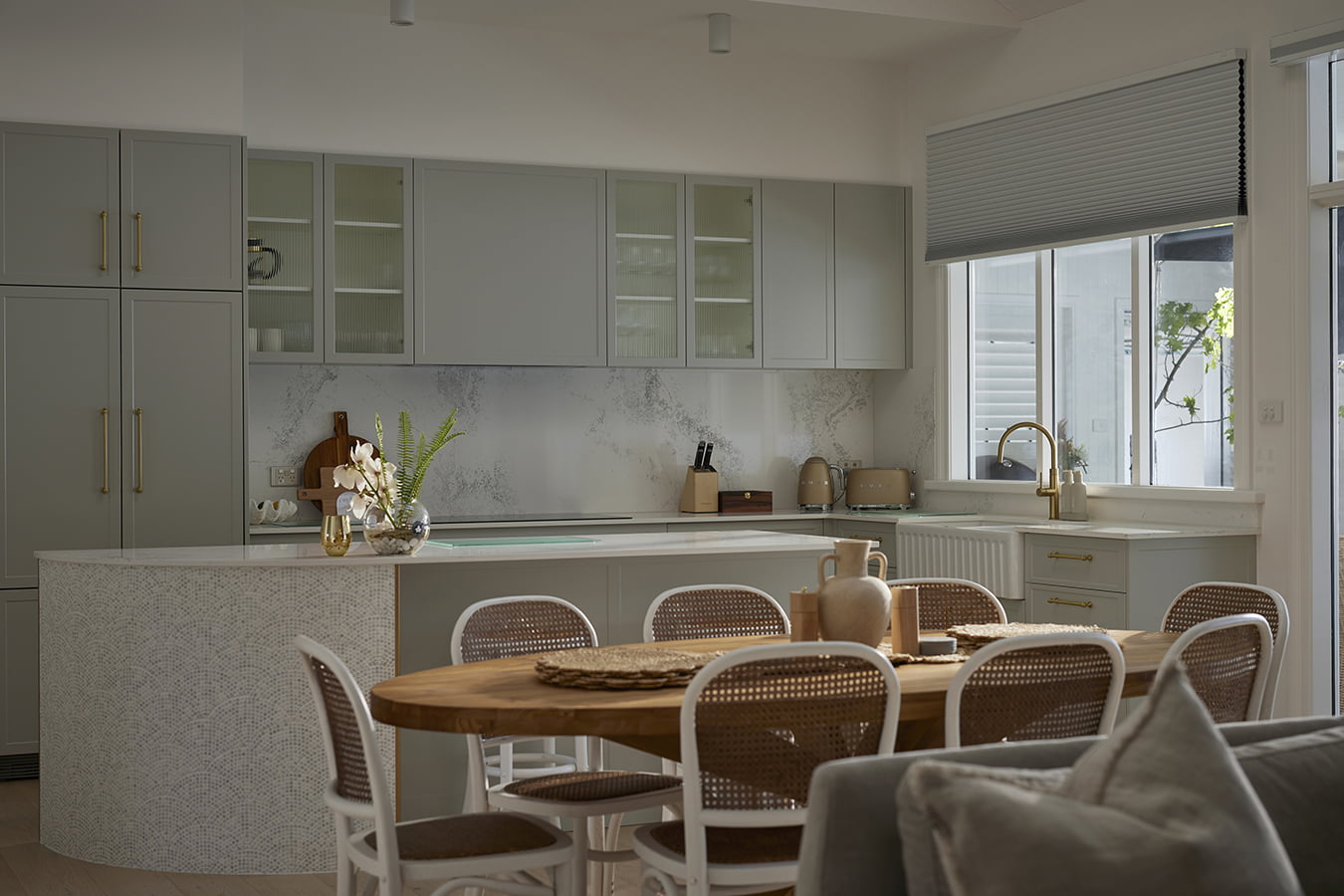 Motorised honeycomb shade installed above a kitchen window